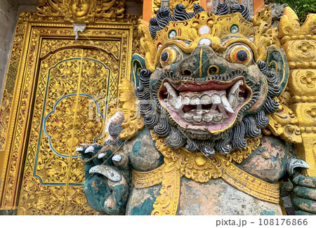 Traditional old ancient Balinese statue of demon angel called barong bali guarding sacred ritual temple 108176866