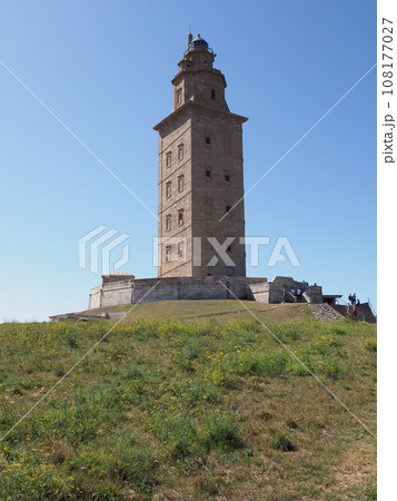 Grassy hill and tower of Hercules in A Coruna city in Spain - vertical 108177027