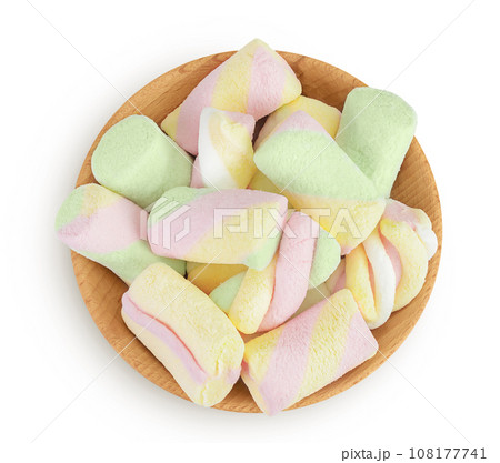 Colorful mini marshmallows in wooden bowl isolated on white background with full depth of field. Top view. Flat lay Colorful mini marshmallows in wooden bowl isolated on white background with full depth of field. Top view. Flat lay 108177741