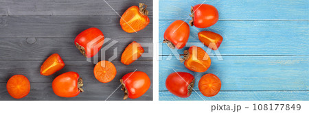 persimmon on black wooden background with copy space for your text. Top view. Flat lay pattern persimmon on black wooden background with copy space for your text. Top view. Flat lay pattern 108177849