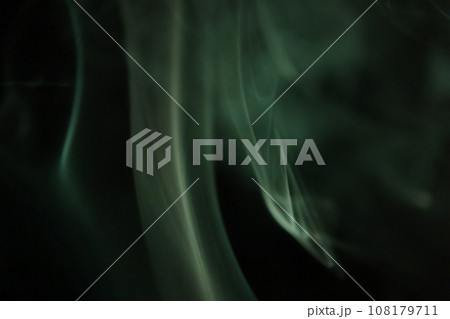 Green smoke on a dark background, colourful abstract green fog, minimalistic background,  108179711