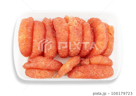 Fresh pealed pomelo fruit on white plastic tray with clipping path, top view 108179723
