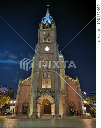 Myeongdong Cathedral at night time with group of Korean people stand on stairs. Myeongdong Cathedral at night time with group of Korean people stand on stairs. 108182460