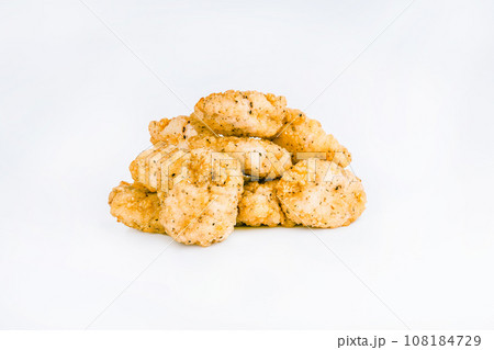 Breaded Chicken Inner Fillet on a White Background,Chicken Breaded Raw Meat.Chicken Breaded Fillet. Breaded chicken nuggets. Fast homemade food at home. Chicken breaded schnitzels. Fast cooking. 108184729