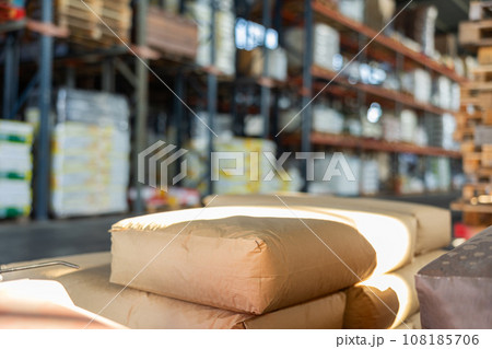Several paper bags, bales, lie on trolley cart in the warehouse of wholesale store Several paper bags, bales, lie on trolley cart in the warehouse of wholesale store 108185706