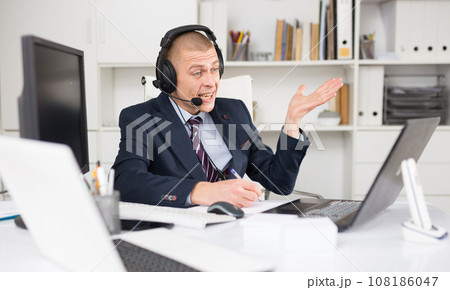 Portrait of friendly man call center operator 108186047