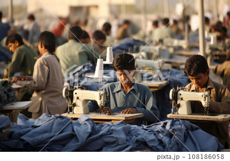 Children in Pakistan as young as 57 years old sewing clothes in a factory 108186058