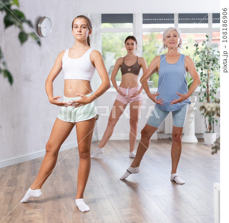 Women of different ages doing choreography in dance studio Women of different ages doing choreography in dance studio 108186906