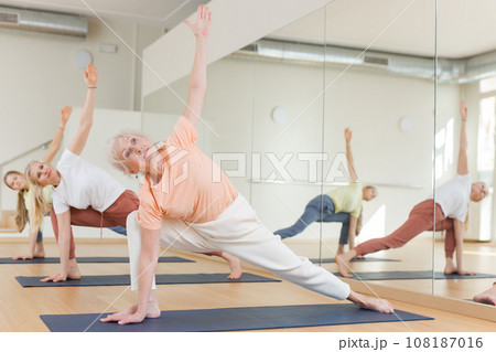 Senior woman exercising stretching workout 108187016