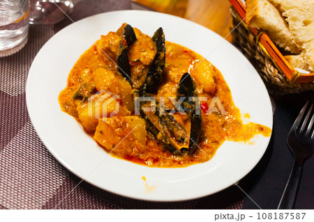 Stew with potatoes, white fish fillets and mussels Stew with potatoes, white fish fillets and mussels 108187587