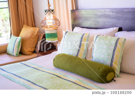pillow and cushions on the bed 108188200