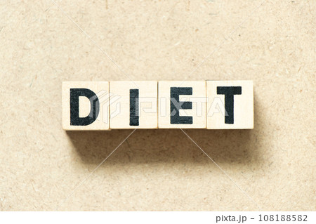 Alphabet letter block in word diet on wood background Alphabet letter block in word diet on wood background 108188582