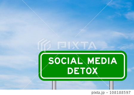 Green color transportation sign with word social media detox on blue sky with white cloud background 108188597