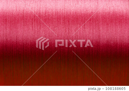 Closed up of red color of thread textured background (Focus at center of picture) Closed up of red color of thread textured background (Focus at center of picture) 108188605