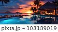 Tropical resort pool and huts at sunset. 21 to 9 aspect ratio. Generative AI 108189019