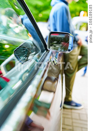 Side mirror on a vintage car. Vintage car parts.  108189185