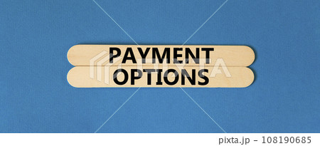 Payment options symbol. Concept words Payment options on beautiful wooden stick. Beautiful blue table blue background. Business payment options concept. Copy space. 108190685