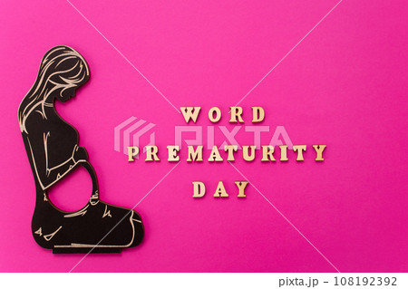 World Prematurity day concept. Banner with the inscription in wooden letters and pregnant woman. 108192392