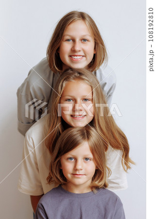 Faces of three girls in a row in casual clothes Faces of three girls in a row in casual clothes 108192810