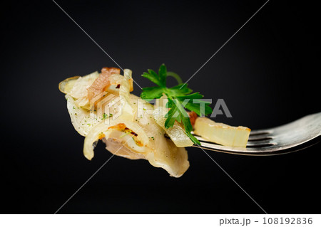 Ukrainian dumplings stuffed with potatoes and mushrooms, served with fried onions. Ukrainian dumplings stuffed with potatoes and mushrooms, served with fried onions. 108192836