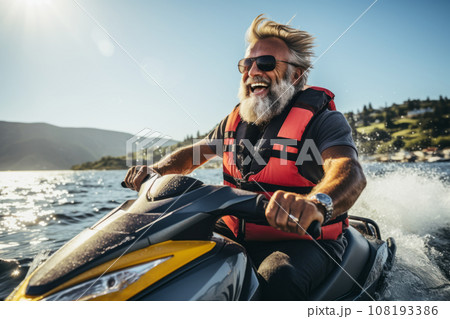 Elderly happy couple having fun on jet ski during beach island tour - Active seniors and world travel concept with seniors riding on jet ski - Warm vintage vibrant filter Elderly happy couple having fun on jet ski during beach island tour - Active seniors and world travel concept with seniors riding on jet ski - Warm vintage vibrant filter 108193386