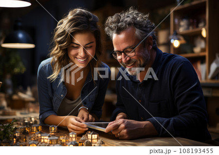 A man and a woman discuss a project in the evening in the office. business people meet in the office, analyze the results and formulate a strategy 108193455
