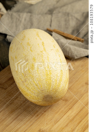 long ripe yellow melon on the table long ripe yellow melon on the table 108193579