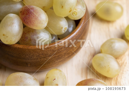 Homemade green unwashed grapes on a board 108193673