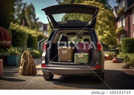 Open trunk of a car with suitcases and belongings Open trunk of a car with suitcases and belongings 108193734