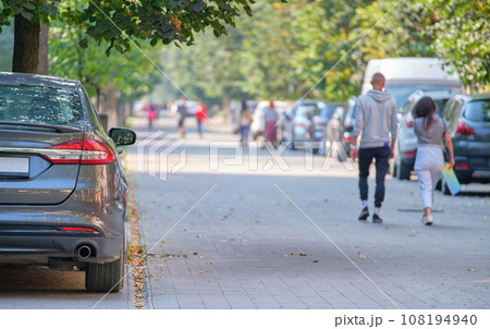 Close up of a car parked illegally against traffic rules on pedestrian city street side. Close up of a car parked illegally against traffic rules on pedestrian city street side. 108194940