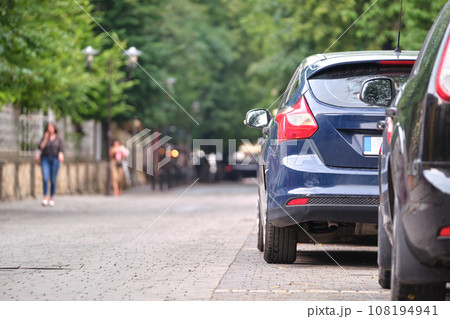Close up of a car parked illegally against traffic rules on pedestrian city street side 108194941