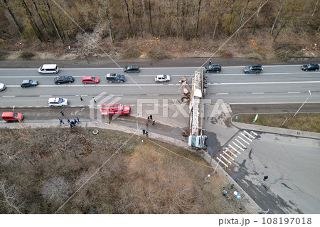 Aerial view of road accident with overturned truck blocking traffic 108197018