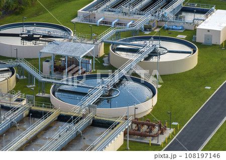 Aerial view of modern water cleaning facility at urban wastewater treatment plant. Purification process of removing undesirable chemicals, suspended solids and gases from contaminated liquid 108197146