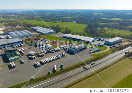 Aerial view of goods warehouses and logistics center in industrial city zone from above 108197270