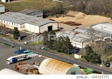 Aerial view of goods warehouses and logistics center in industrial city zone from above Aerial view of goods warehouses and logistics center in industrial city zone from above 108197271