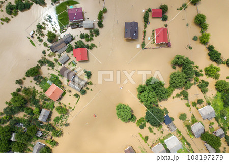 Aerial view of flooded houses with dirty water of Dnister river in Halych town, western Ukraine. Aerial view of flooded houses with dirty water of Dnister river in Halych town, western Ukraine. 108197279