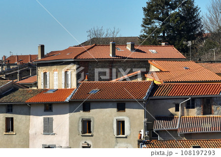 Aerial view of dense historic center of Thiers town in Puy-de-Dome department, Auvergne-Rhone-Alpes region in France. Rooftops of old buildings and narrow streets Aerial view of dense historic center of Thiers town in Puy-de-Dome department, Auvergne-Rhone-Alpes region in France. Rooftops of old buildings and narrow streets 108197293