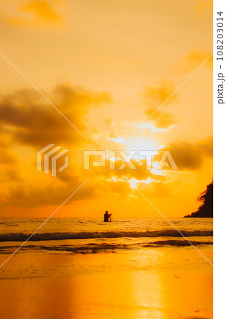 Layan Beach, Phuket, Thailand,Silhouette Two Asians standing fishing at the sea as the sun sets, 108203014