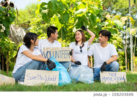 Happy young Asian students diverse volunteers hold a campaign sign for cleaning in the park, The concept of environmental conservation on world environment day, recycling, charity for sustainability. Happy young Asian students diverse volunteers hold a campaign sign for cleaning in the park, The concept of environmental conservation on world environment day, recycling, charity for sustainability. 108203606
