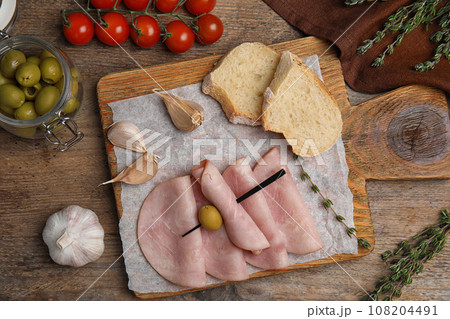 Tasty ham served on wooden table, flat lay 108204491