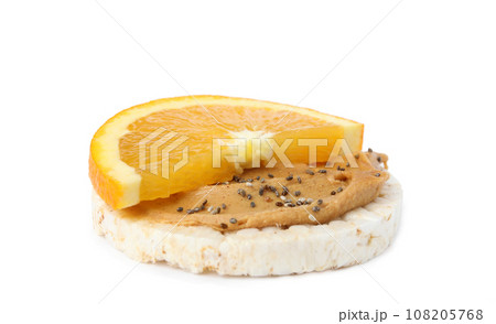 Puffed rice cake with peanut butter and orange isolated on white 108205768
