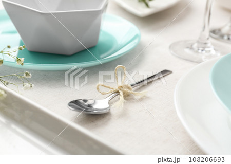 Spoon with rope on table. Stylish setting 108206693
