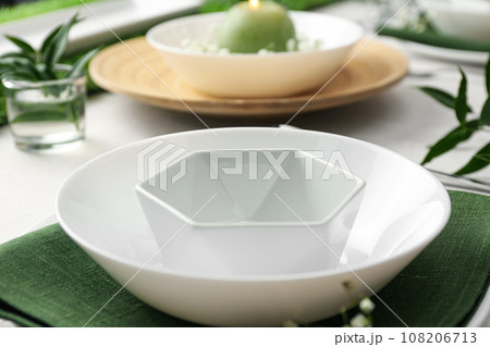 Stylish dishes on table, closeup. Festive setting Stylish dishes on table, closeup. Festive setting 108206713