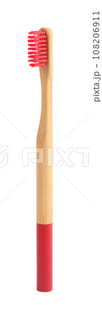 Bamboo toothbrush with red bristle isolated on white Bamboo toothbrush with red bristle isolated on white 108206911