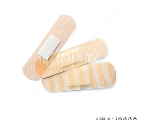 Medical sticking plasters isolated on white. First aid item Medical sticking plasters isolated on white. First aid item 108207090