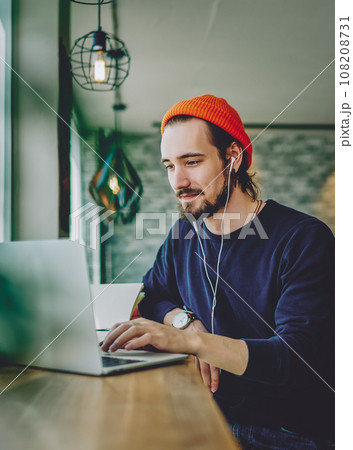 skilled freelancer enjoying remote job typing publication for web blog on laptop 108208731