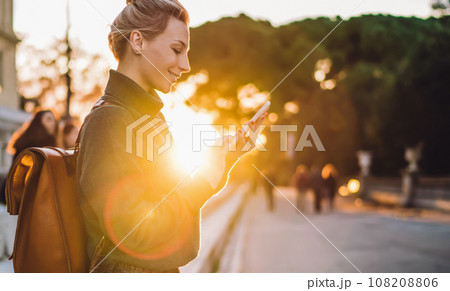 positive woman with mobile device networking 108208806