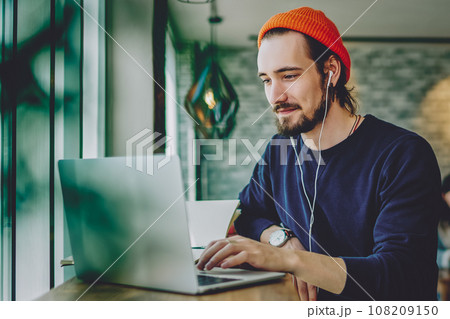 skilled freelancer enjoying remote job typing publication for web blog on laptop 108209150