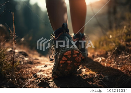 A person explores the tranquil beauty of the forest while hiking along a picturesque trail, surrounded by nature's wonders. AI Generative. 108211054
