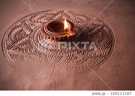 Burning diya on Happy Diwali, background for light festival of India 108211587